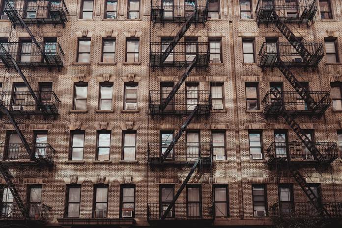 Photo by Aleks Marinkovic brown concrete building with glass windows