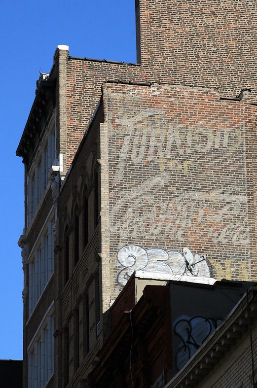 NYC's Ghost Signs: Whispers of Lost Businesses 6