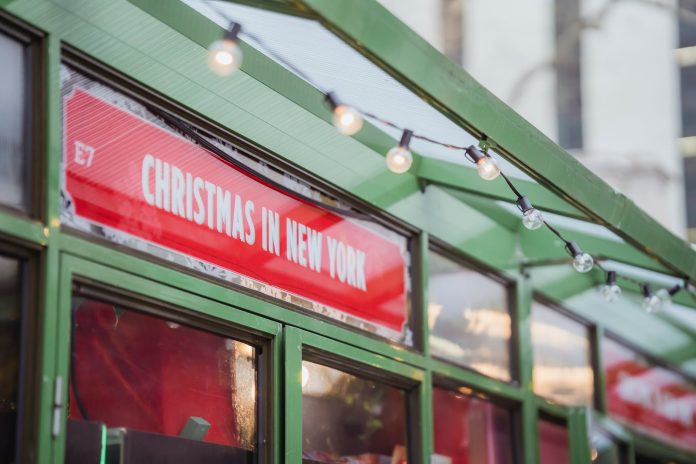 banner hanging on new york street during christmas
