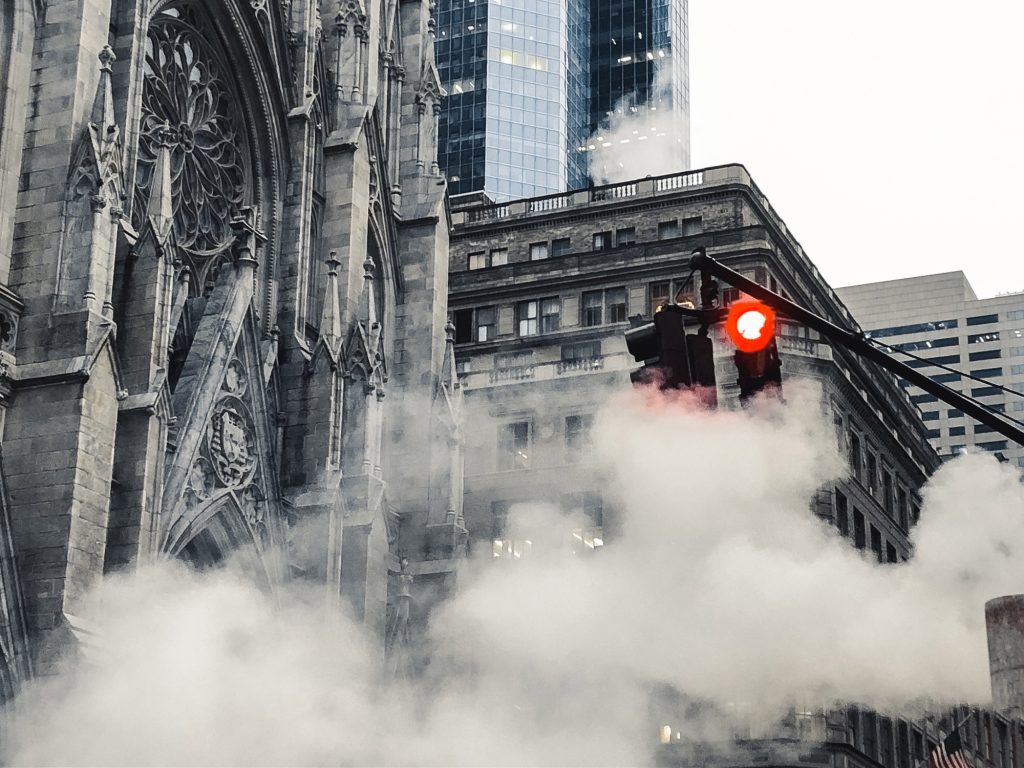 Red traffic light in the steam in New York city